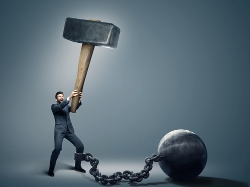 Conceptual image of a businessman holding big hammer