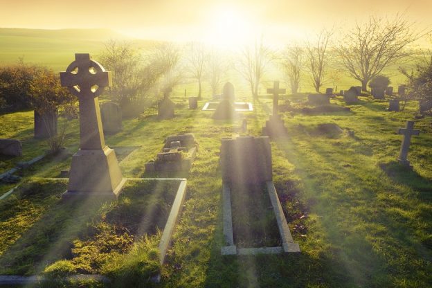Heavenly light shining upon a old graveyard